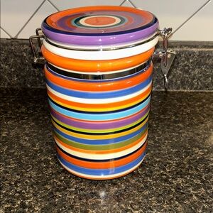 Like new living art “Casablanca” canister with hinged lid.